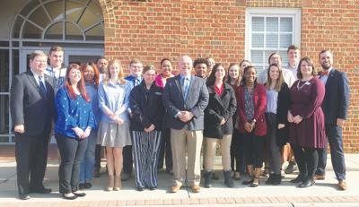 Congressman Denver Riggleman with bank personnel and students