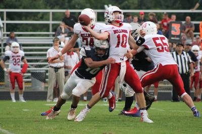 Appomattox linebacker Keyshawn Baker (#10) bears down on LCA quarterback Joshua Nelson.
